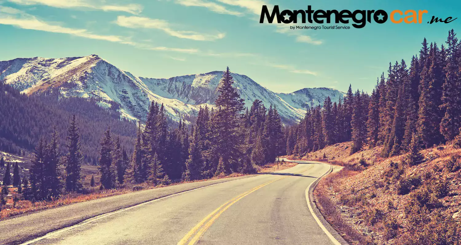 A mountain road surrounded by untouched natural scenery